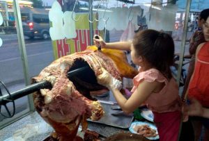 Carving the meat in Mỹ Xuân