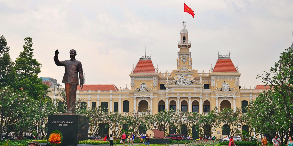 A picture of the Ho Chi Minh Statue in front of the People's Committee Buidling in Ho Chi Minh city