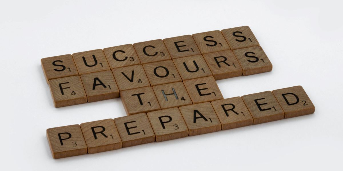 Scrabble tiles reading ' success favors the prepared.'