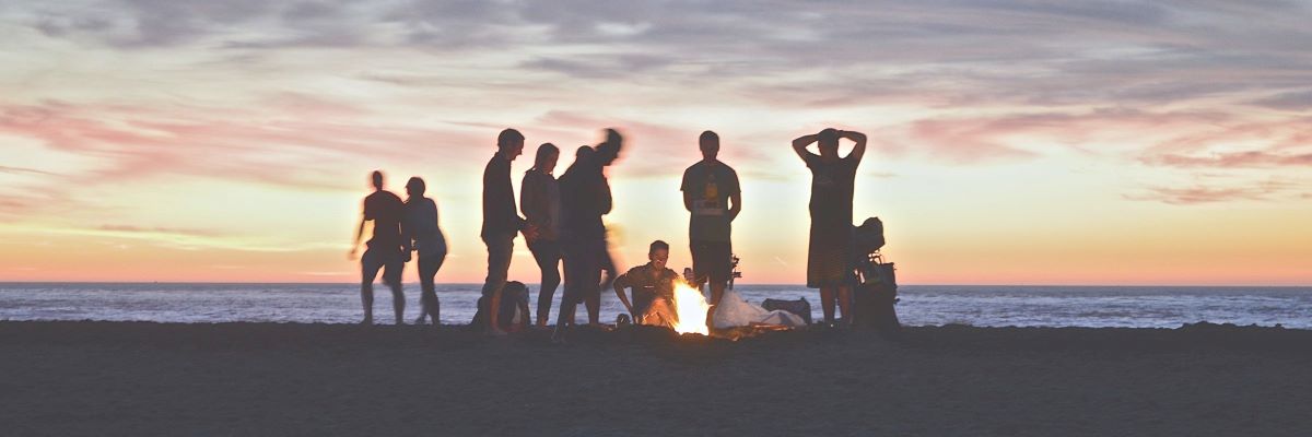 A picture of travel friends on the beach at sunset