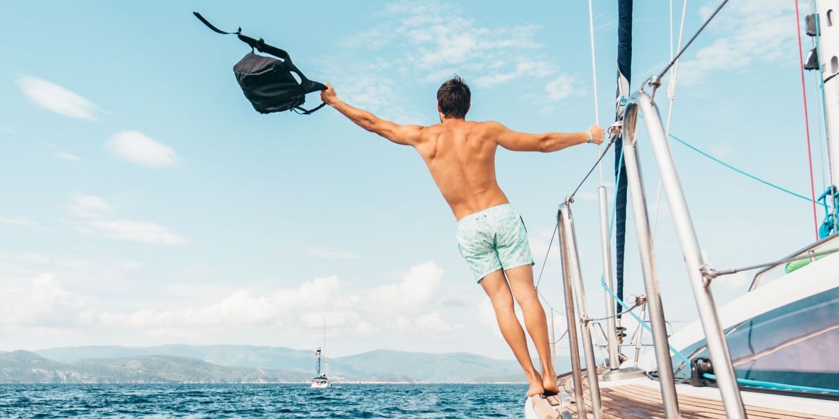 Man enjoying himself on a yacht in the greek islands